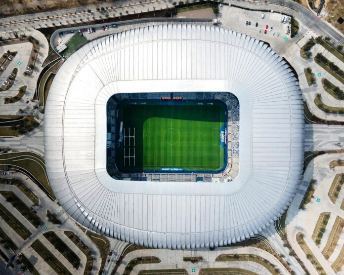 Aerial view of a modern football stadium in Mexico representing Liga MX infrastructure and matchday environment