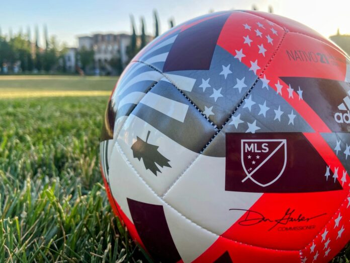 MLS match ball on a training pitch, symbolising youth development pathways and access within the US football system.