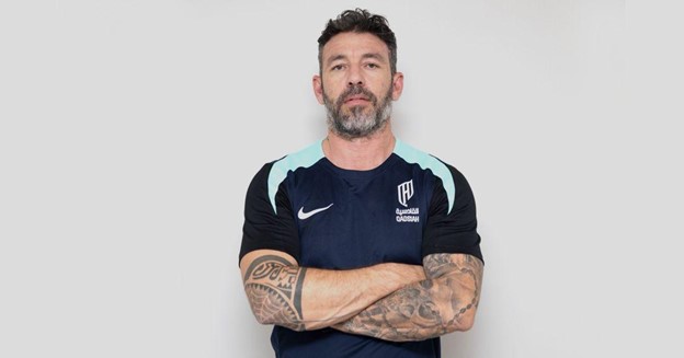 Dr. Simone Fornari, Italian football performance expert, wearing a training shirt with arms crossed.