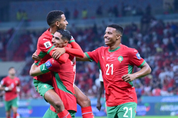 Moroccan national team players celebrating a goal during their 5-0 victory over Niger, securing qualification for the 2026 FIFA World Cup.