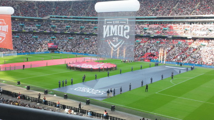 Packed Wembley Stadium during the opening ceremony of the Sidemen Charity Match 2025 with banners and fans filling the stands.