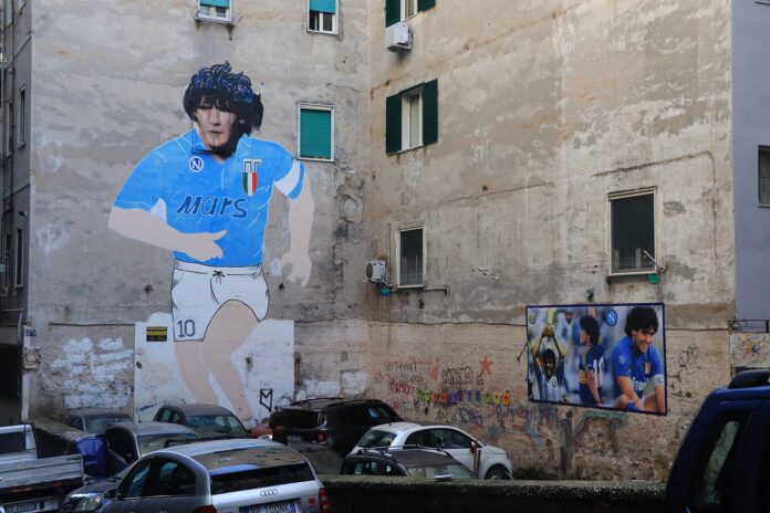Wall murals of Diego Maradona in Naples showing his lasting legacy with Napoli and his deep connection to the city and its people.