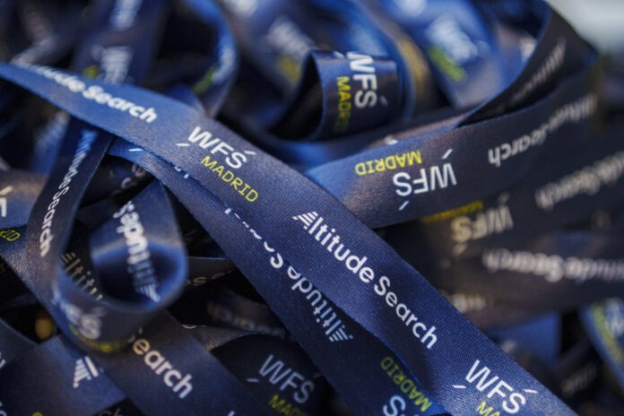 Close-up of WFS Madrid 2025 event lanyards featuring Altitude Search branding.