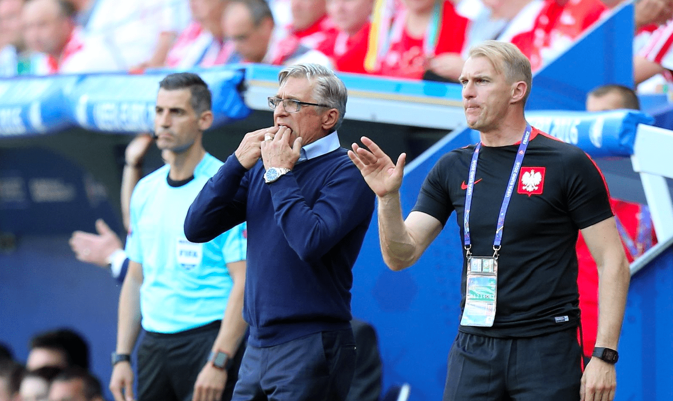 Jarosław Tkocz on the touchline beside Poland manager Adam Nawałka during an international match.