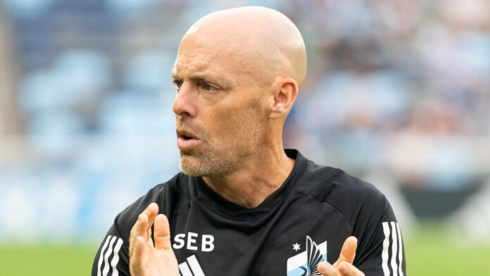 Sean Buckley coaching on the pitch during a training session, showcasing his leadership and performance expertise.