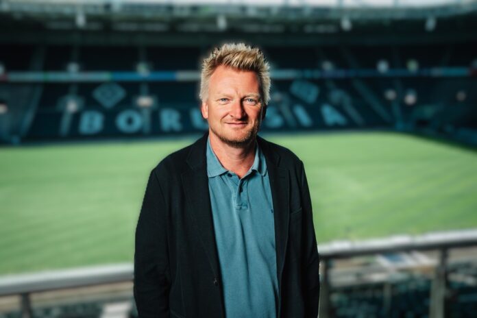 Bastian Huber, football executive and former technical director, pictured in a professional stadium environment.