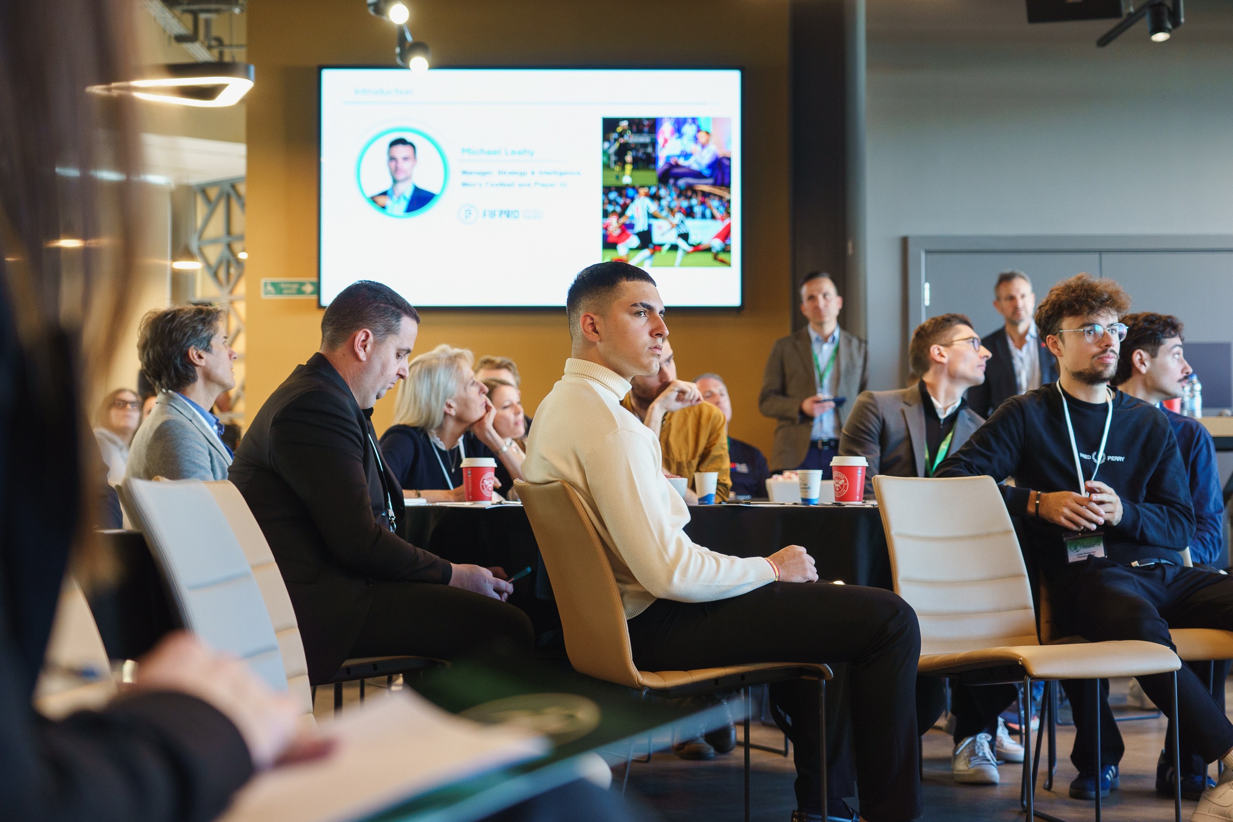 Former academy player attending a football industry event, showing alternative pathways within the professional game.