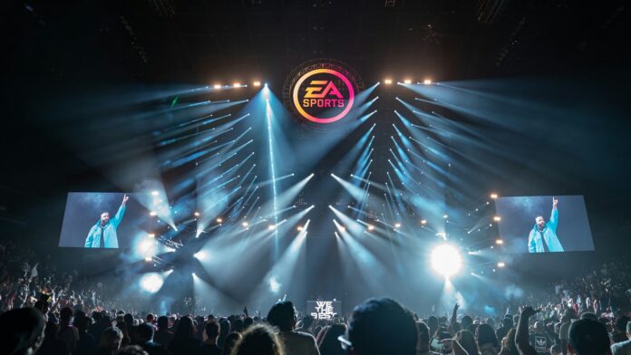 EA Sports logo displayed above a live esports arena stage with bright lights and a cheering crowd.