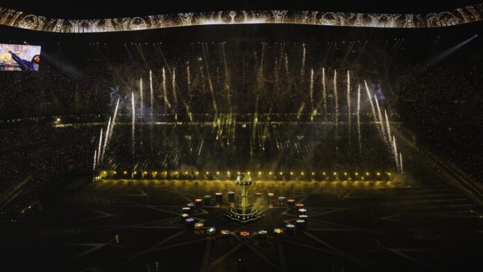 AFCON stadium ceremony with trophy centre stage, fireworks and crowd during Africa Cup of Nations final