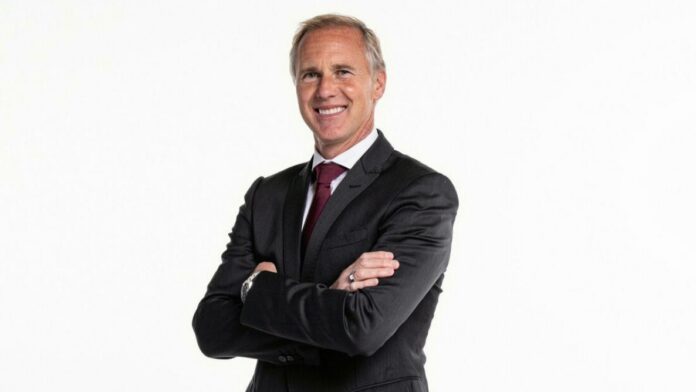 Chris Henderson, MLS Sporting Director, in formal attire representing leadership in football operations