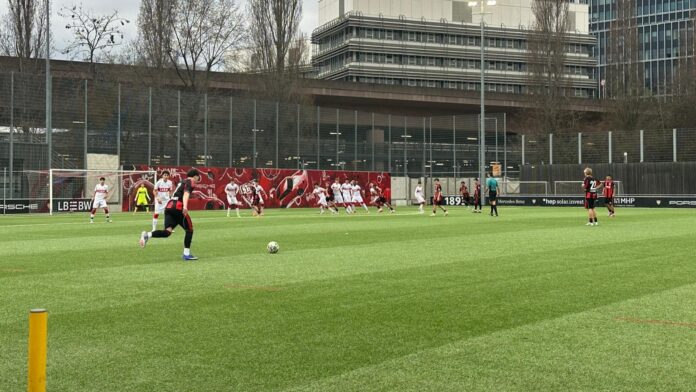 Youth football match at a German training centre highlighting the development pathway from academy football to the professional game.
