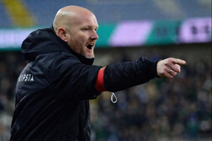 Markus Pflanz giving tactical instructions from the touchline during a professional football match