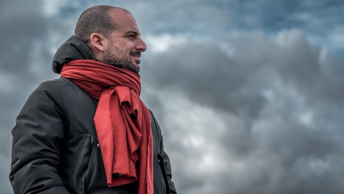 Mirco Papaleo observing play pitchside, reflecting his role in scouting and player evaluation in modern football.