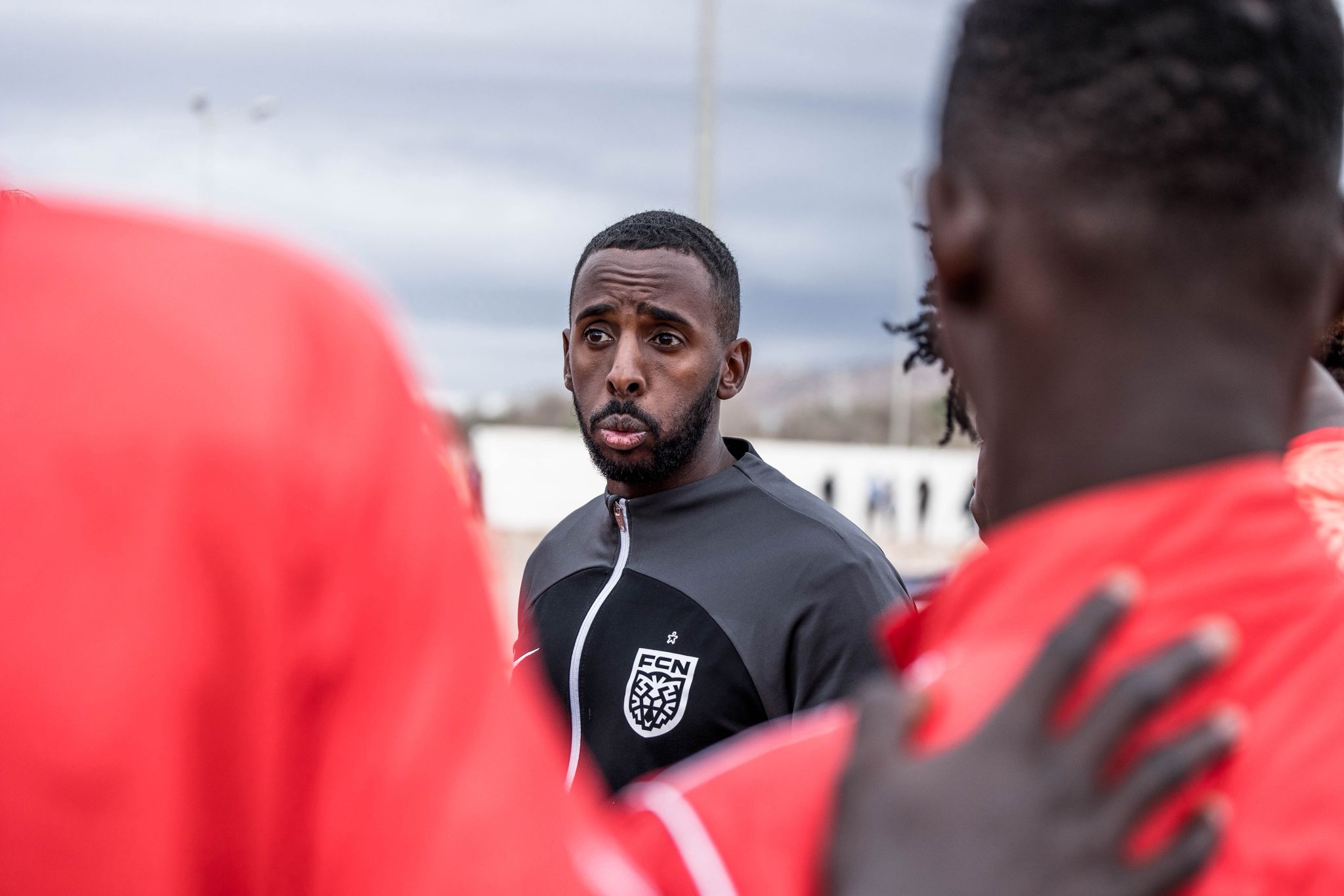 Fatah Abdirahman leading a training session with players in Denmark during a coaching session