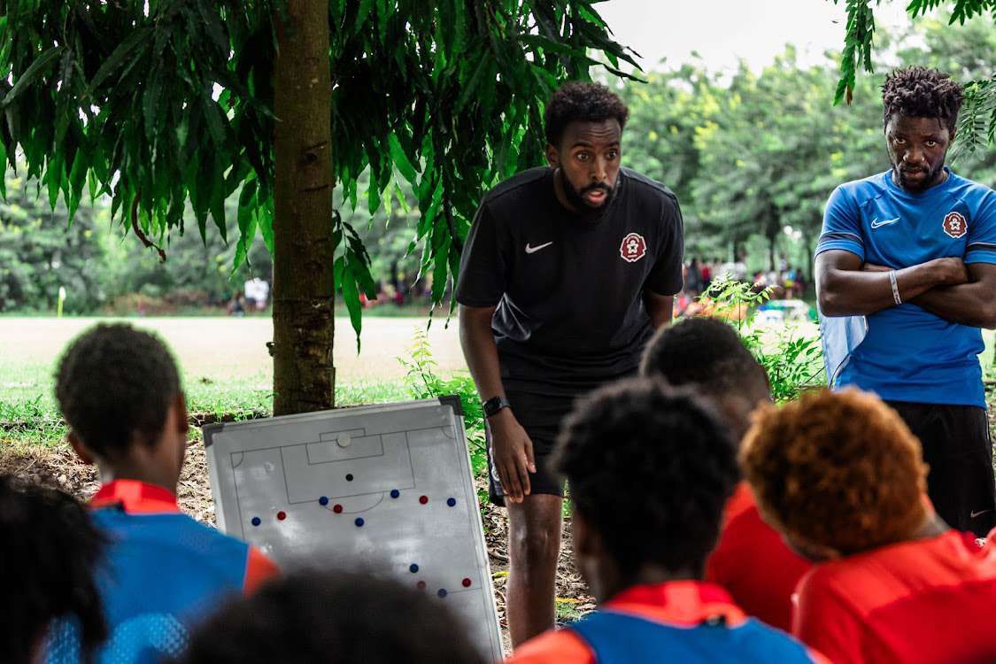 Fatah Abdirahman coaching players in Ghana at Right to Dream Academy during a training session