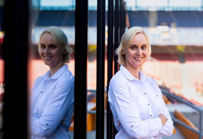 Pavla Satrapova standing at Sparta Praha stadium reflecting leadership in women’s football development