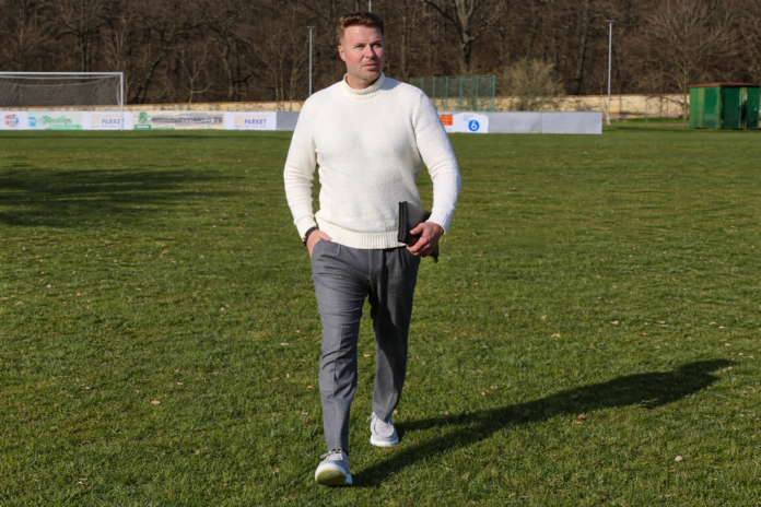 Michael Provaznik attending a live football scouting assignment at a professional training ground.