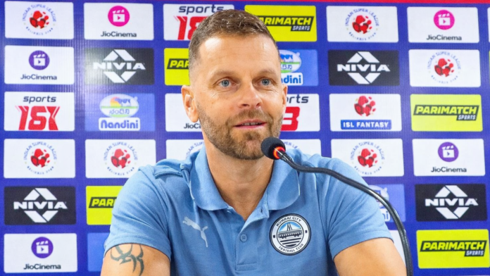 Petr Kratky speaking during a Mumbai City FC press conference in the Indian Super League.