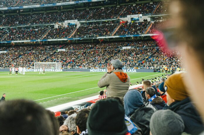 Football fans at the Santiago Bernabéu, reflecting loyalty, identity and belonging in supporter culture.