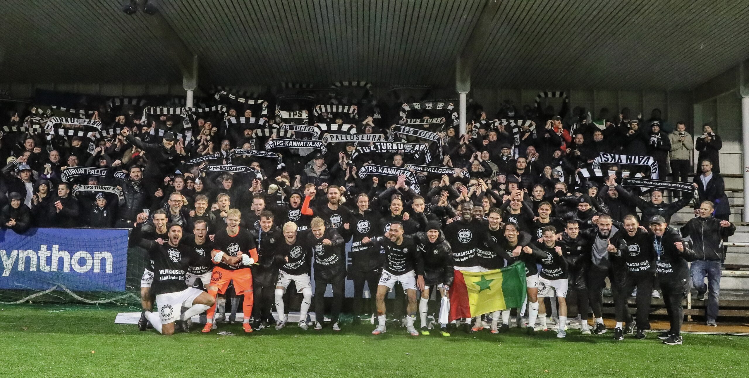 TPS players and supporters celebrate promotion to the Veikkausliiga under Ivan Piñol Zoroa.