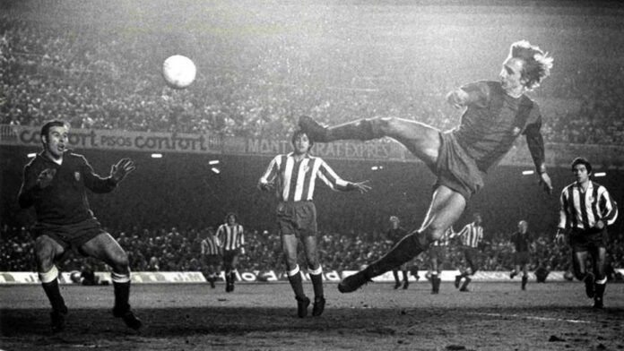 Johan Cruyff in mid-air during an iconic football moment, reflecting the artistry of the classic number 10.