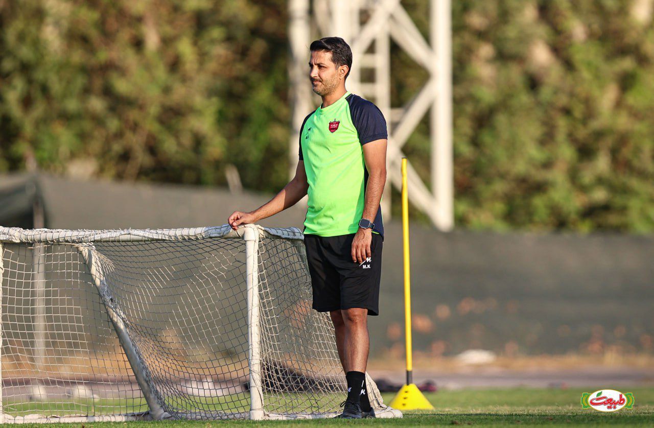 Mehrdad Khanban observing training during a football session, reflecting coaching, analysis and player development.