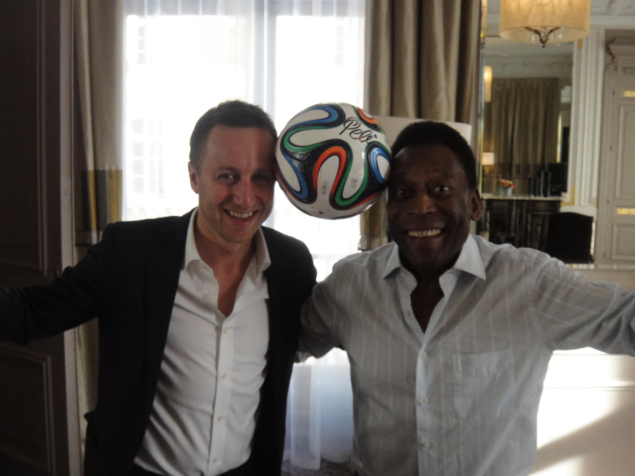 Misha Sher with Pelé during a football industry meeting focused on global athlete influence.