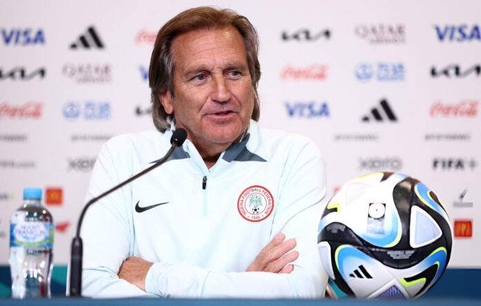 Randy Waldrum speaking at a Nigeria press conference, reflecting his leadership in women’s football.