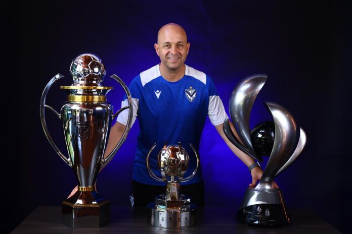 Sebastián Pait with Vélez trophies, highlighting his leadership in Argentine football talent development.