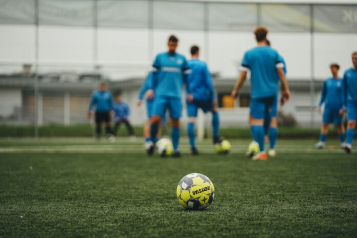 Young footballers training in an academy setting, reflecting U22 player development and MLS roster strategy.