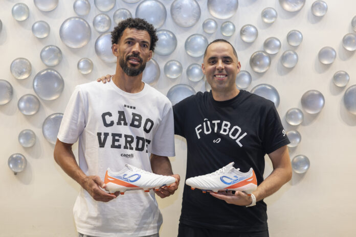 Vozinha and Santiago Halty hold Senda football boots during Cape Verde’s World Cup story.