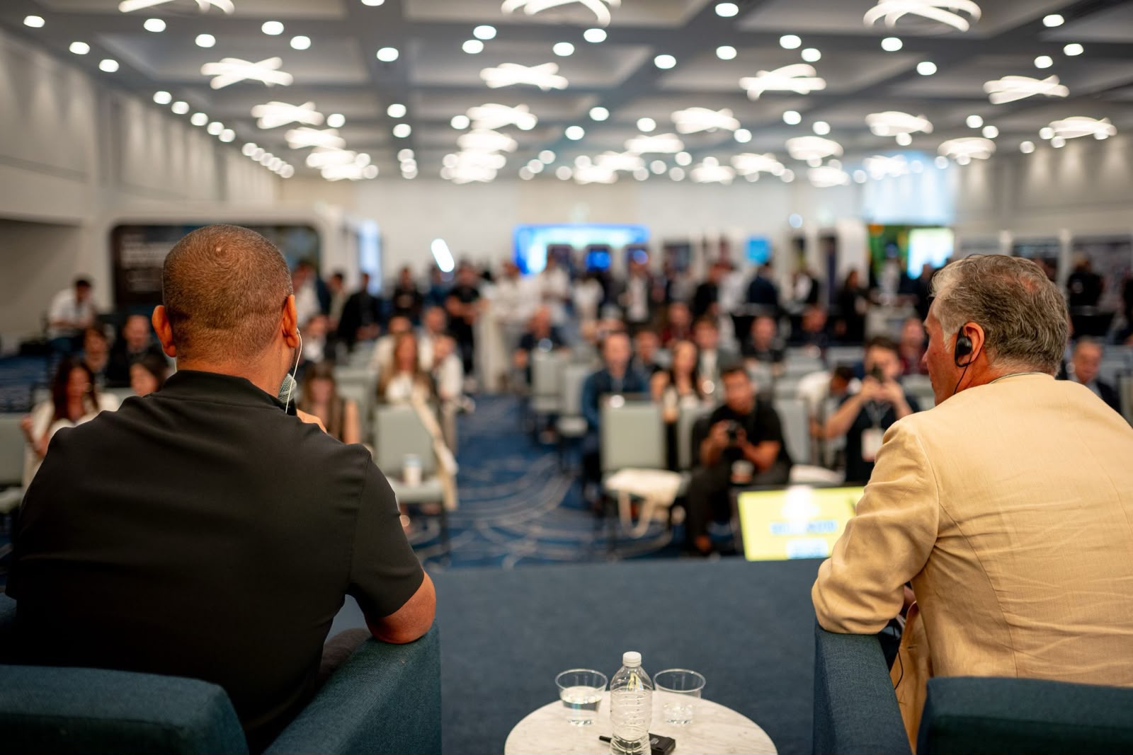 Confut USA football business event panel with speakers addressing industry professionals.