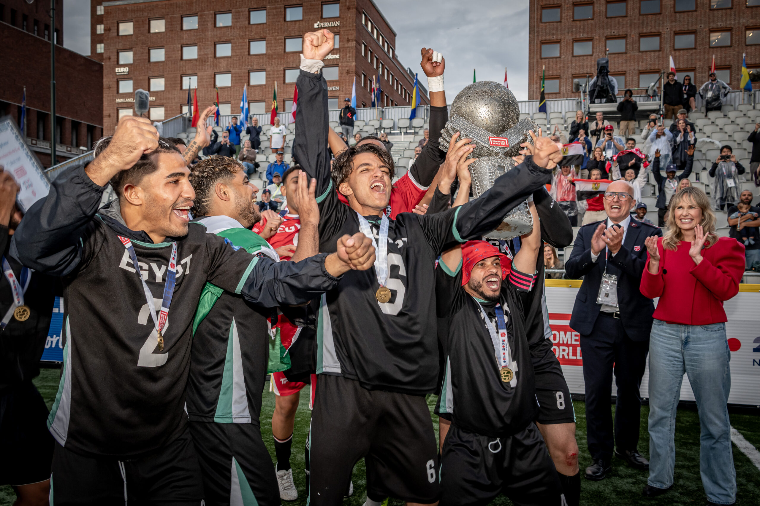 Winning team lifts the trophy at the Homeless World Cup final ceremony.