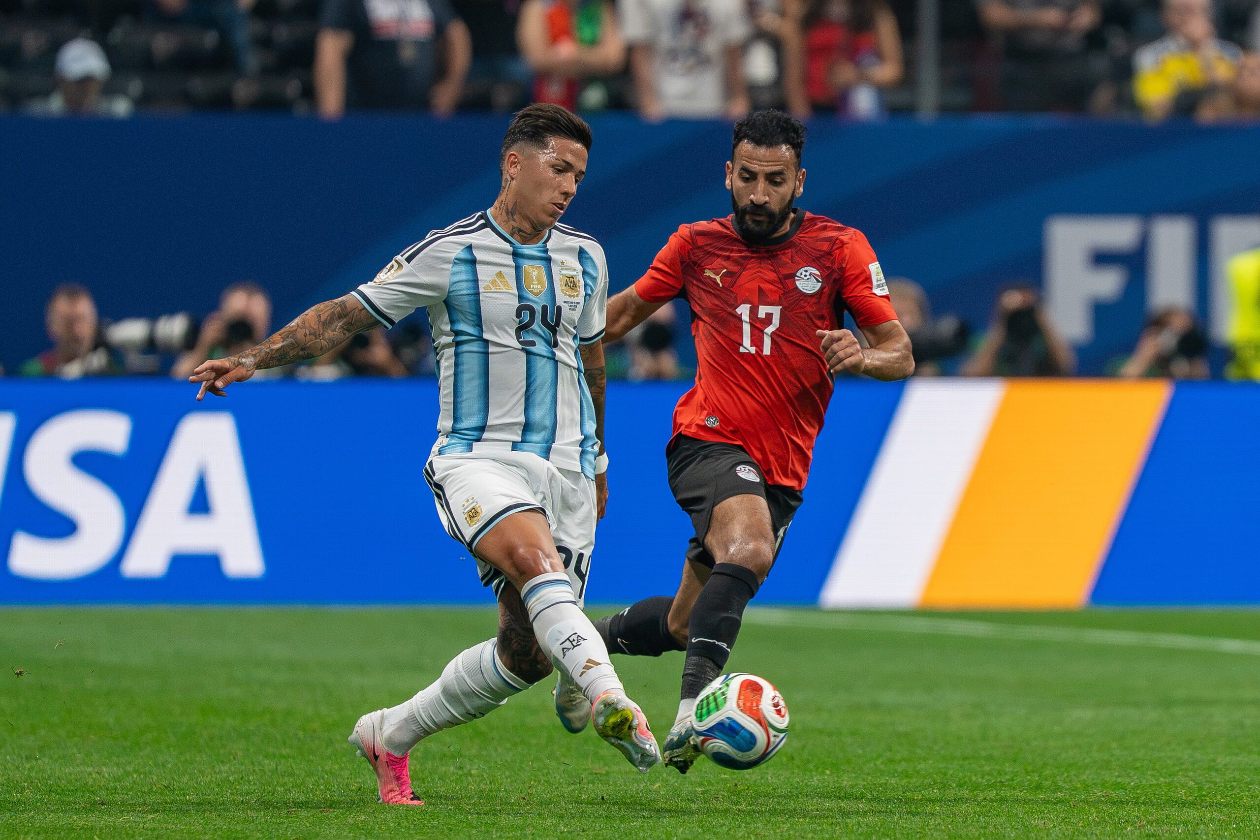 Enzo Fernández battles Mohanad Lasheen during Argentina v Egypt at the 2026 FIFA World Cup