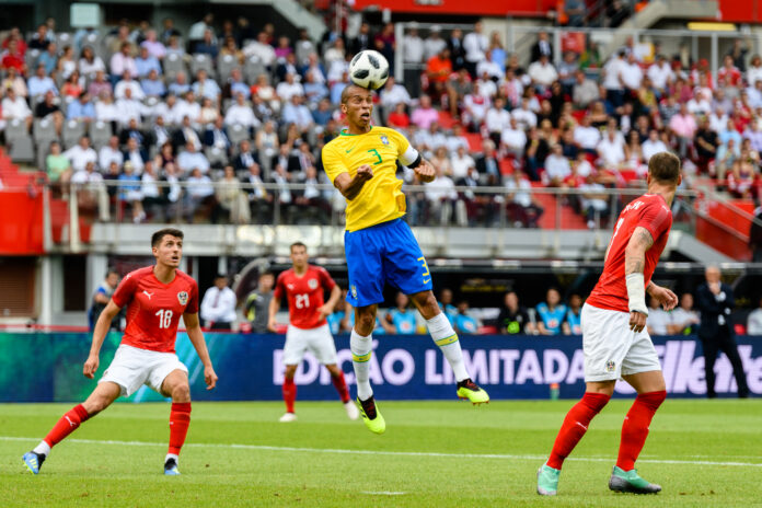 Miranda heads the ball for Brazil against Austria in a 2018 FIFA friendly in Vienna