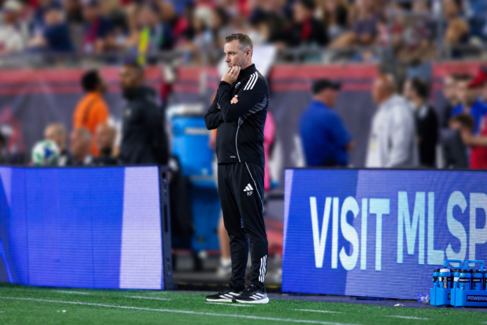 Kevin Flanagan on the touchline during an MLS match, reflecting his leadership role in player development.