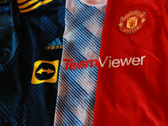 Manchester United shirts showing front-of-shirt sponsor branding and club crest