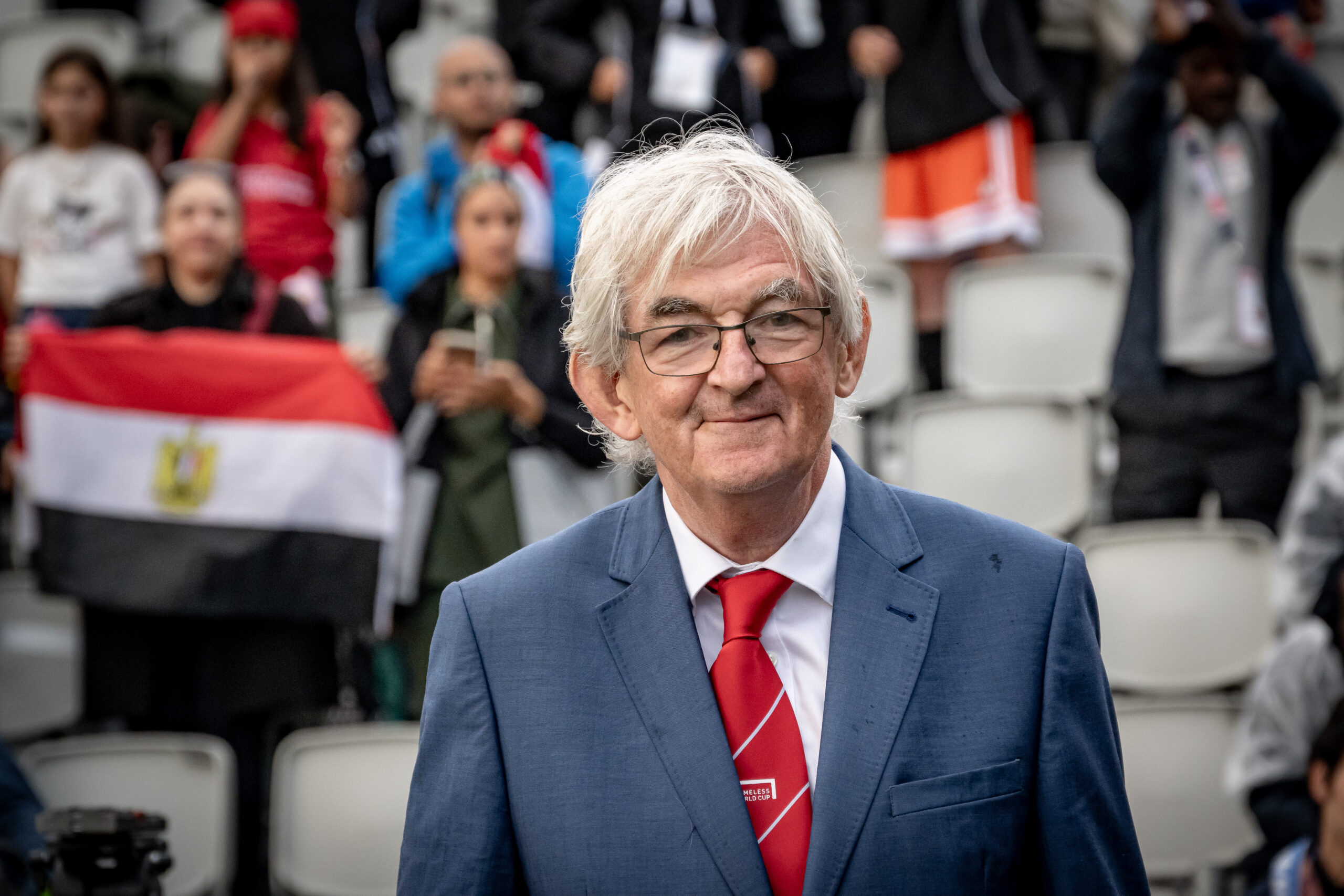 Homeless World Cup co-founder Mel Young at the tournament, highlighting football’s role in social change.