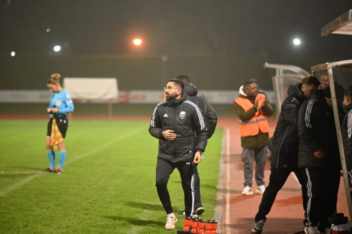 Ekrem Aker coaching from the touchline during a football match in Switzerland.