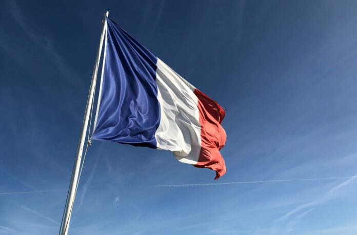 French flag representing the regulatory landscape for foreign football agents operating in France.