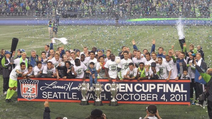 Seattle Sounders celebrate winning the 2011 Lamar Hunt U.S. Open Cup with the trophy in Seattle.