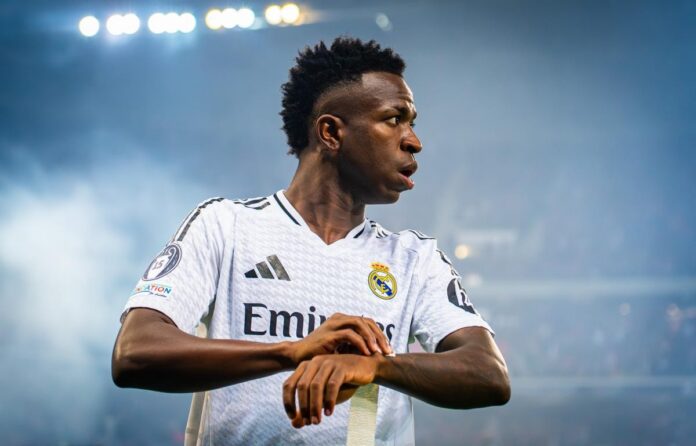 Vinícius Júnior wearing Real Madrid’s Emirates-sponsored shirt, highlighting football shirt sponsorship and global brand exposure.